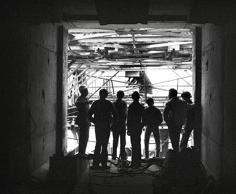 Workers silhouetted 